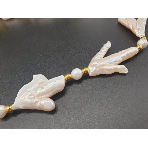 92 - A rarely seen, Keshi pearls necklace and earrings set of pearls in the shape of bird’s feet. In a pr... 