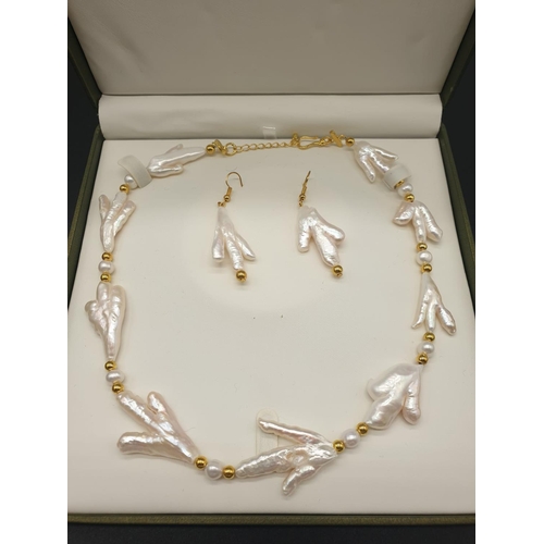 92 - A rarely seen, Keshi pearls necklace and earrings set of pearls in the shape of bird’s feet. In a pr... 