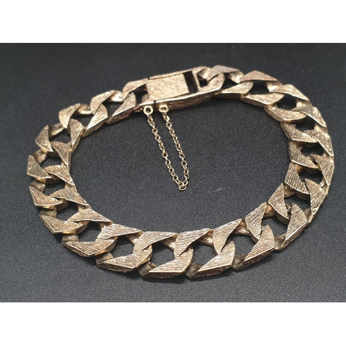 13 - 9ct yellow gold heavy curb bracelet. Length 23cm Total weight 42 grams.