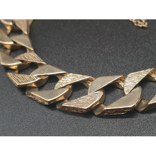 13 - 9ct yellow gold heavy curb bracelet. Length 23cm Total weight 42 grams.