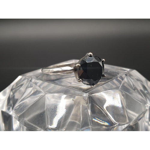 187 - 14ct white gold single solitaire with a fancy black round brilliant cut 1.25ct diamond, ring size J.... 