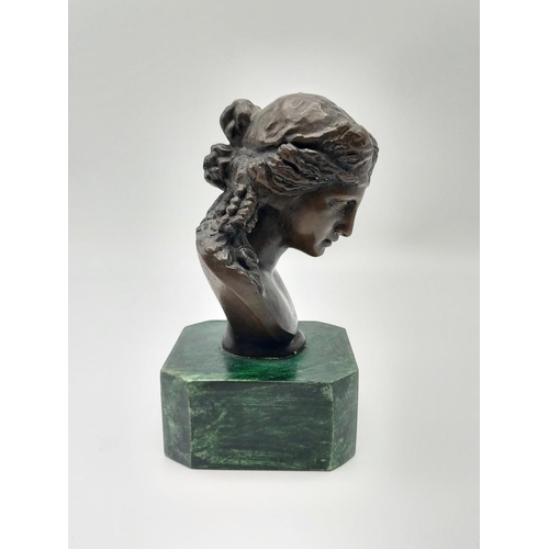 337 - A French Bronze Bust on a Malachite Base. Signed by the sculptor. 15.5cm tall.