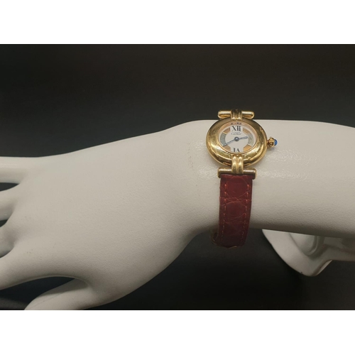 34 - A ladies 9ct Cartier Vermil quartz watch, with tricolour design on dial, comes with original strap. ... 