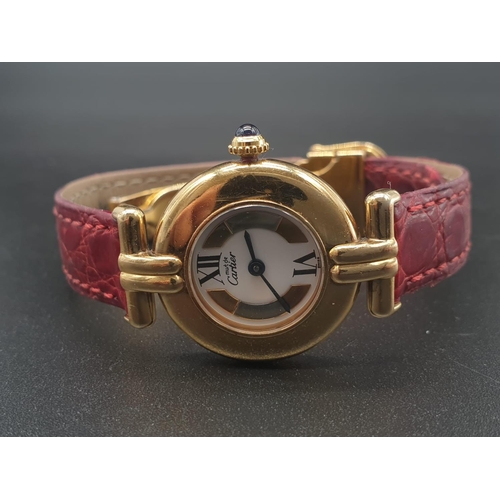 34 - A ladies 9ct Cartier Vermil quartz watch, with tricolour design on dial, comes with original strap. ... 