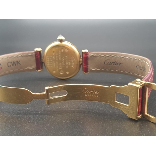 34 - A ladies 9ct Cartier Vermil quartz watch, with tricolour design on dial, comes with original strap. ... 