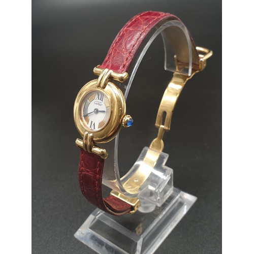 34 - A ladies 9ct Cartier Vermil quartz watch, with tricolour design on dial, comes with original strap. ... 