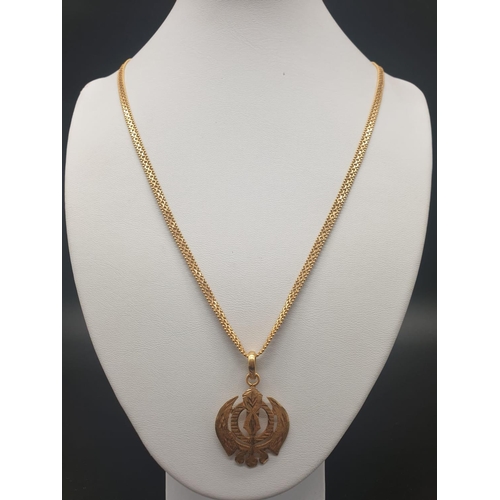 62 - A 22ct yellow gold necklace and pendant in a Khanda style design. Length of chain 48cm. Pendant leng... 