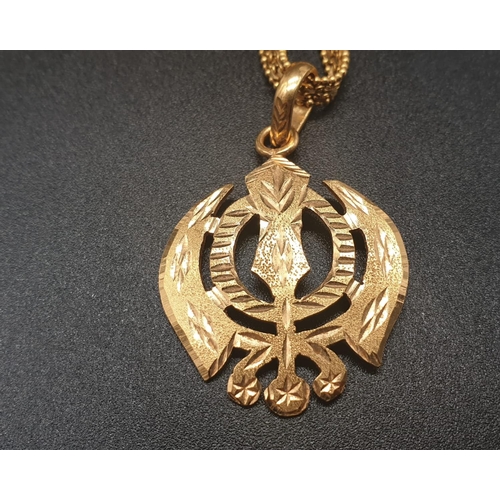 62 - A 22ct yellow gold necklace and pendant in a Khanda style design. Length of chain 48cm. Pendant leng... 