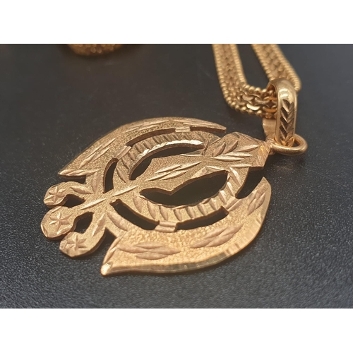 62 - A 22ct yellow gold necklace and pendant in a Khanda style design. Length of chain 48cm. Pendant leng... 