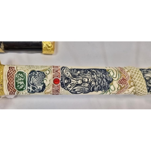 134 - An Ancient Warrior White Dragon Ninja Bushido Katana.
Decorative handle with black scabbard. Length ... 