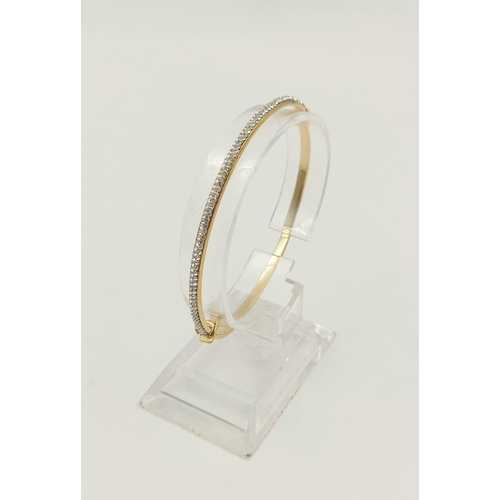 242 - A 9K Yellow Gold Half Eternity Diamond Bangle.
6cm diameter. 3.7g