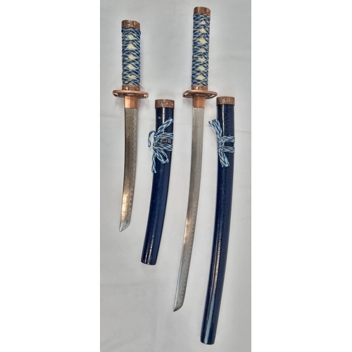 247 - An Ancient Warrior Wakizashi and Tanto Blade Set. 
Hard resin blue scabbard with cloth, resin and br... 