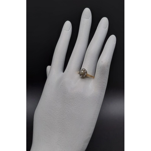 68 - An 18k Yellow Gold Eight-Diamond and Seed Pearl Ring.
Size Q. 2.44g.