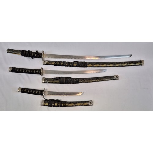 135 - A Katana, Wakizashi and Tanto Blade Set. All with decorative handles and scabbards. Blade lengths - ... 