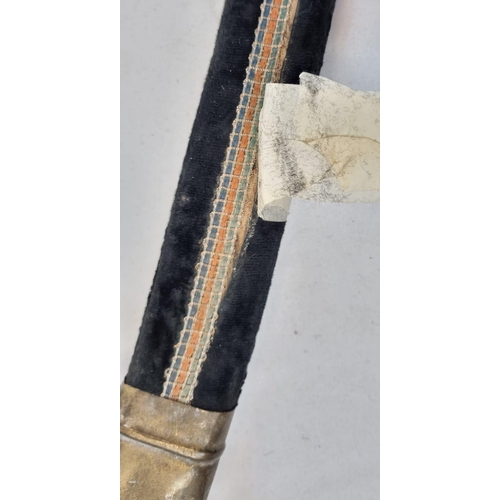 127 - An Antique Talwar Sword with a Brass and Leather Grip.
Made in India engraving on base  of blade. Co... 