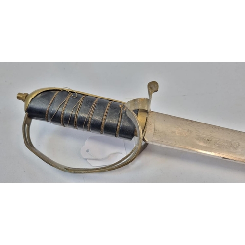 127 - An Antique Talwar Sword with a Brass and Leather Grip.
Made in India engraving on base  of blade. Co... 