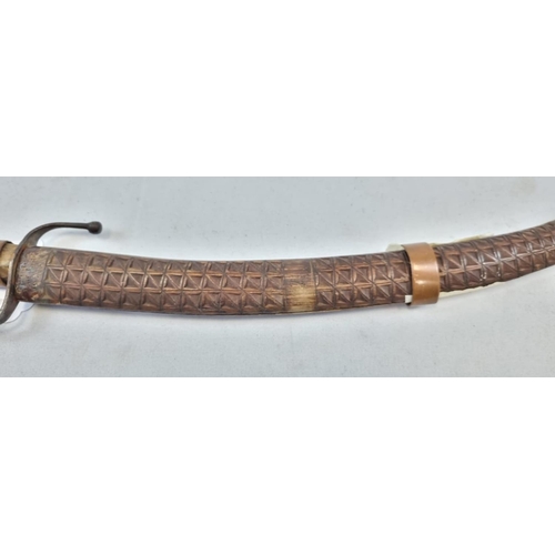 169 - An Antique Short Curved-Sword. Engravings on blade.
Decorative wooden scabbard and handle. 38cm leng... 