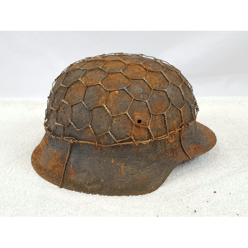 86 - WW2 German M42 Helmet in Normandy Cam and Chicken Wire. No Liner.