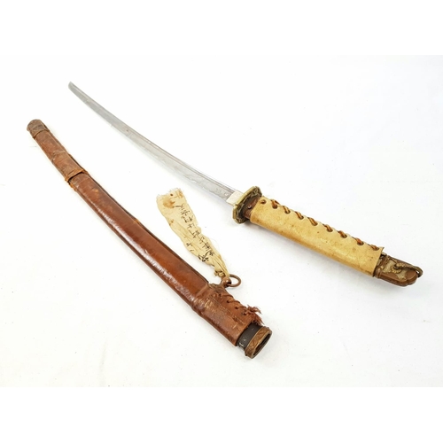 12 - WW2 Japanese Officers Sword. Nice “Hamon” family blade with good markings on the tang. Hand written
... 