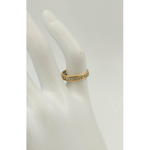 148 - An 18K Yellow Gold Diamond Eternity Ring. Size F.
2.8g