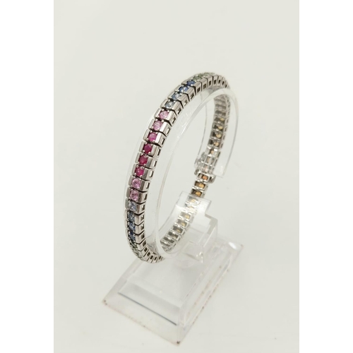 262 - An Absolutely Gorgeous Silver Multi-Coloured Sapphire Bracelet. Over 50 Sapphires! 18cm length.