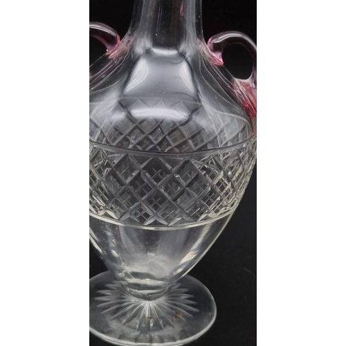 298 - A pretty glass dome vase with delicate pink shoulder handles, featuring a silver top, full UK hallma... 