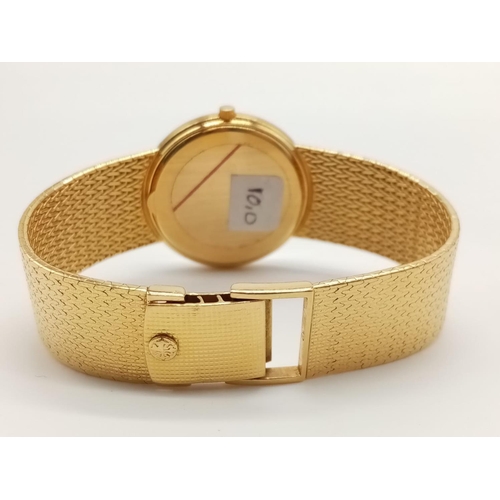 10 - 18K gold Patek Philippe Geneve quartz watch with solid gold strap, 34mm case 
Weight: 82g