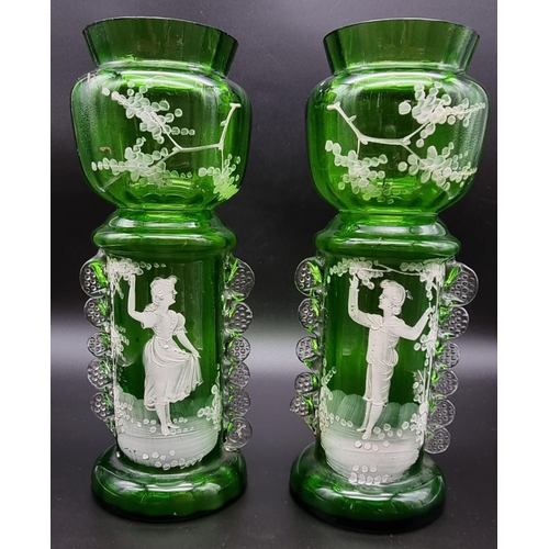 197 - A Pair of Victorian Green Glass Mary Gregory Vases.
27cm tall. Good condition but A/F.