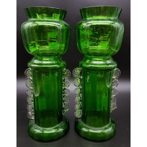 197 - A Pair of Victorian Green Glass Mary Gregory Vases.
27cm tall. Good condition but A/F.