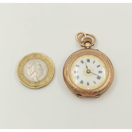 30 - An Antique 9K Yellow Gold Miniature Pocket Watch.
30mm - engraved case. White dial with gilt decorat... 