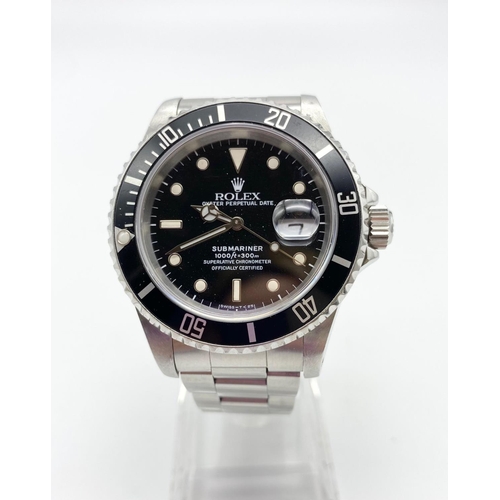 38 - A ROLEX SUBMARINER IN STAINLESS STEEL WITH BLACK FACE AND MATCHING BEZEL.  40mm