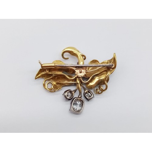 36 - An Art Nouveau, yellow gold, floral brooch with enamel and diamonds. Weight 12.6g. Dimensions: 4.2x3... 