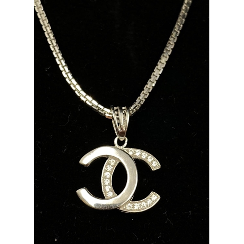 11 - 18k white gold Channel style pendant and chain, chain length 44cm, weighs 7 grams