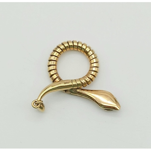 130 - 9k yellow gold snake pendant with ruby eyes, 35mm in length, weighs 4.3 grams