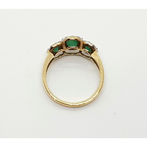 137 - 9k yellow gold diamond and emerald triple cluster ring, weighs 2.1 grams, ring size M