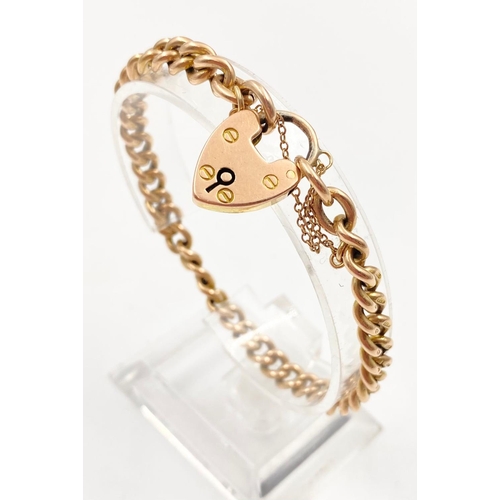 16 - A 9K Yellow Gold Belcher Bracelet with Heart Clasp, individually hallmarked on each link
18cm. 23.58... 