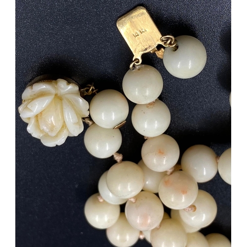 213 - White coral beaded necklace with 14k yellow gold clasp, length 64cm, weighs