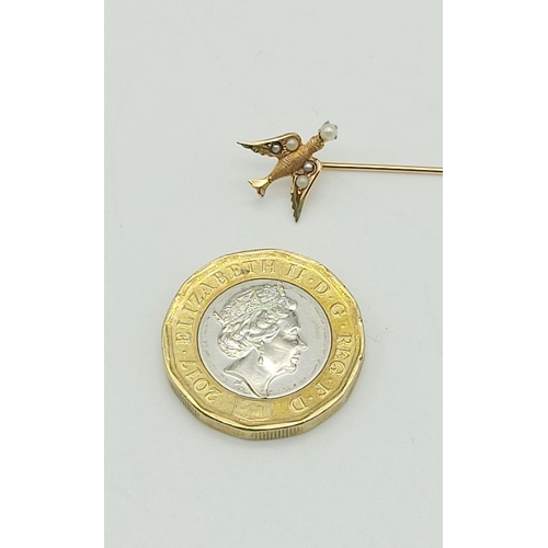 220 - 9k yellow gold tie pin featuring a swallow with seed pearls. weighs 0.7 grams, length 58mm.