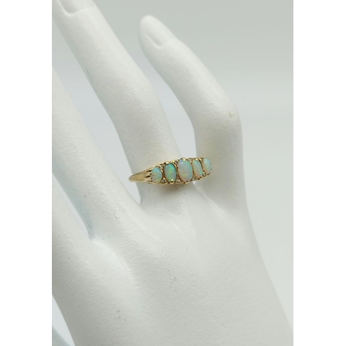 23 - A Beautiful 9K Yellow Gold Five-Stone Opal Ring. Size N.
2.35g