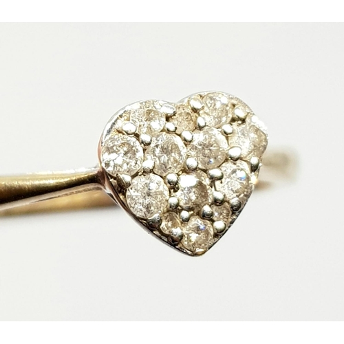 232 - 9k yellow gold diamond heart ring, 0.25ct in diamonds, weighs 2.1 grams, ring size R