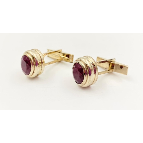 54 - A pair of 14k yellow gold and ruby cufflinks, 4ct in rubies, weighs 10.2 grams