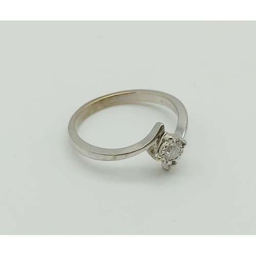 263 - 9k white gold diamond twist solitaire ring, 0.10ct of diamonds, weighs 1.9 grams, ring size N