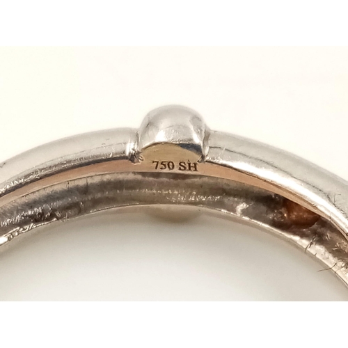 753 - An 18K White Gold Three Diamond Ring. Size M.
3.8g.