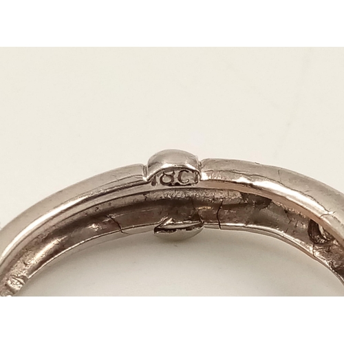 753 - An 18K White Gold Three Diamond Ring. Size M.
3.8g.