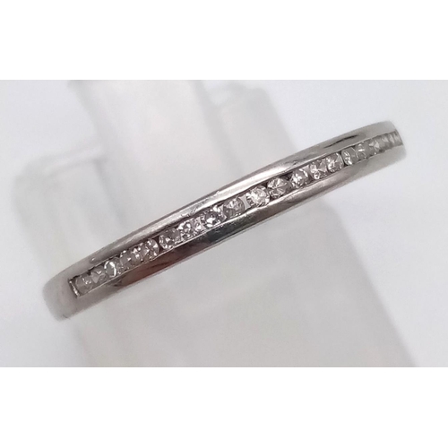 1191 - An 18K White Gold Diamond Half-Eternity Ring. Size M.
2.22g.