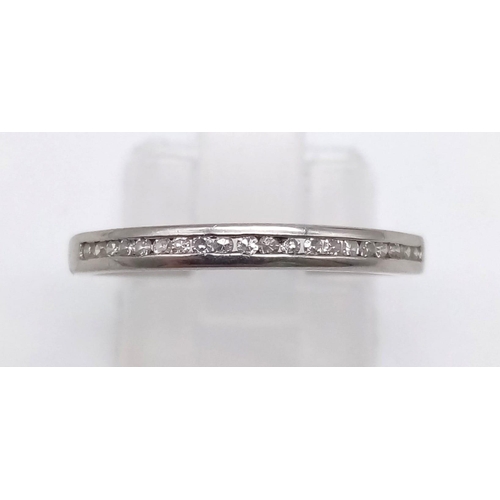 1191 - An 18K White Gold Diamond Half-Eternity Ring. Size M.
2.22g.