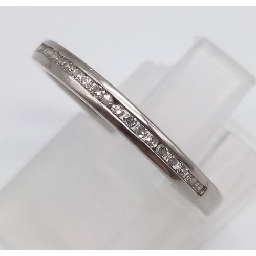 1191 - An 18K White Gold Diamond Half-Eternity Ring. Size M.
2.22g.