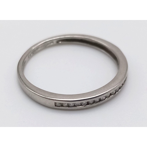 1191 - An 18K White Gold Diamond Half-Eternity Ring. Size M.
2.22g.