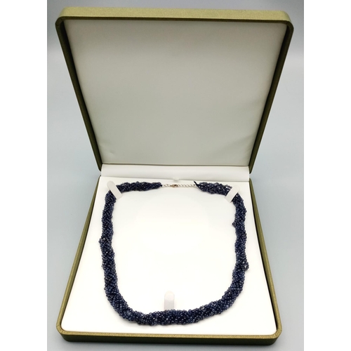 111 - A rare and beautiful, six rows, braided, iolite necklace, in a presentation box. Necklace length: 52... 