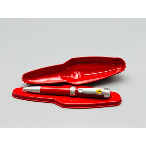 118 - An official merchandise, FERRARI writing pen, in a metal box shaped as a Formula 1 car. Produced by ... 